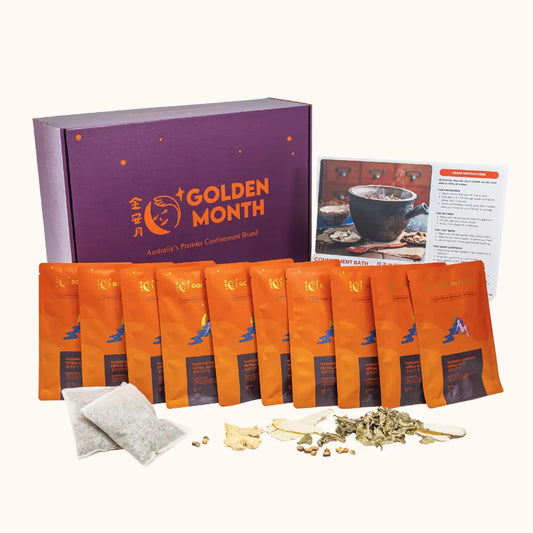 Tea packaging set with orange bags and a purple box labeled 'Golden Month' on a white background.