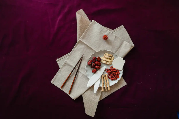 Napkins with food items on a purple fabric background